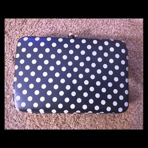 Navy and white polka dot clutch